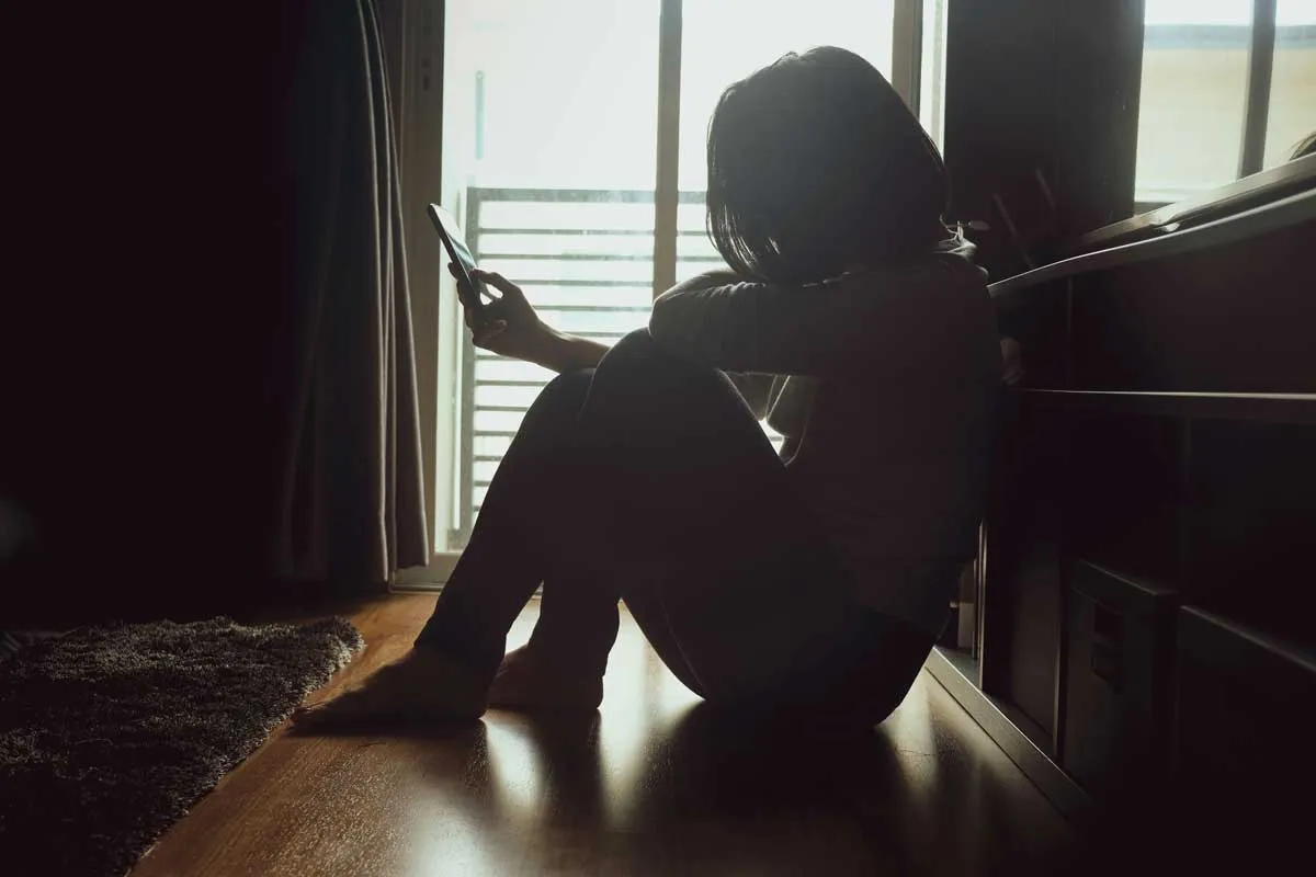 Woman sitting confidently embodying the process of how to move on from an ex